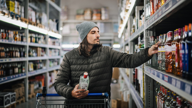 man shopping in liquor store