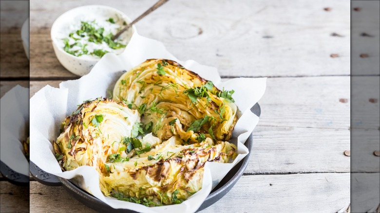 Skillet of roasted cabbage wedges