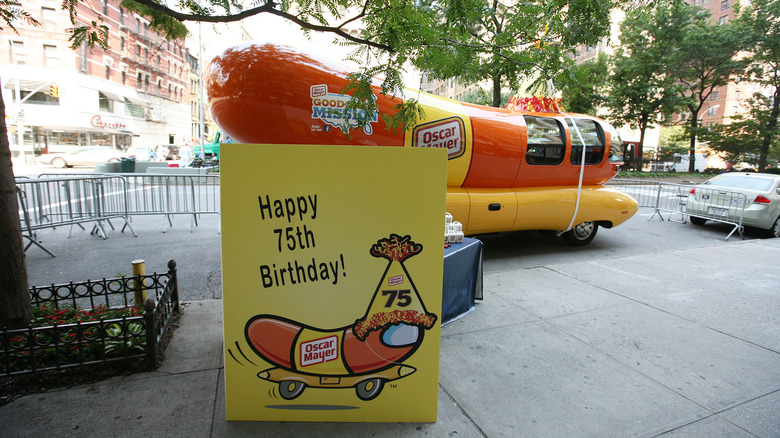 Wienermobile birthday sign on sidewalk