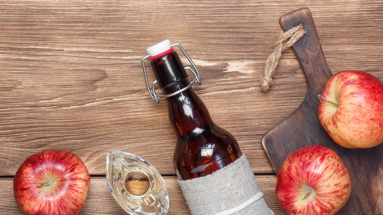 apples and jar on wood