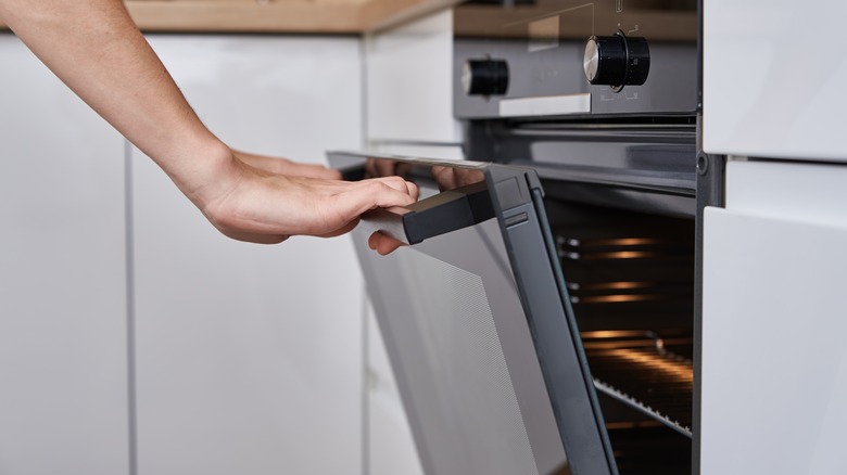 person opening oven