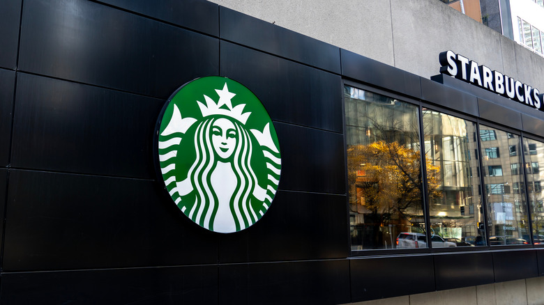 Starbucks Siren logo and name on side of a building