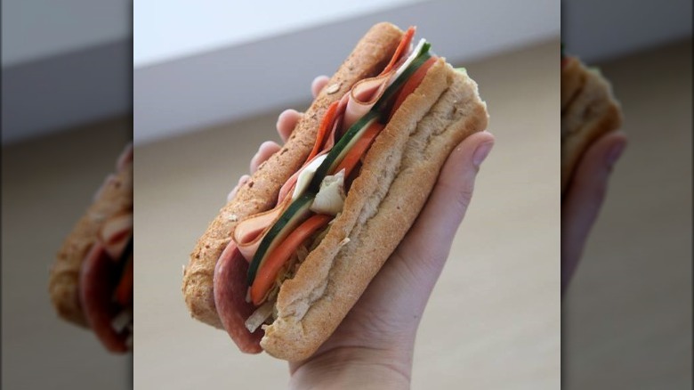 Subway sandwich in hand
