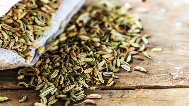 Fennel seeds on wooden table