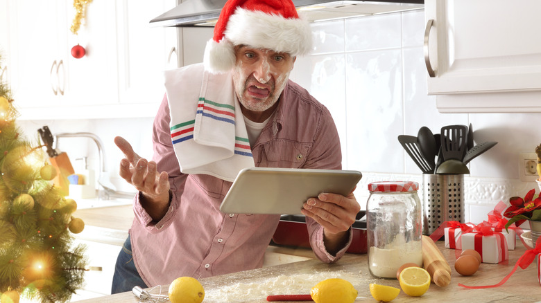 man stressed in kitchen at Christmas