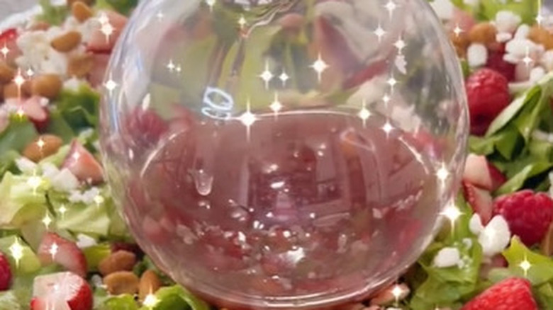 festive salad with dressing in bauble decoration