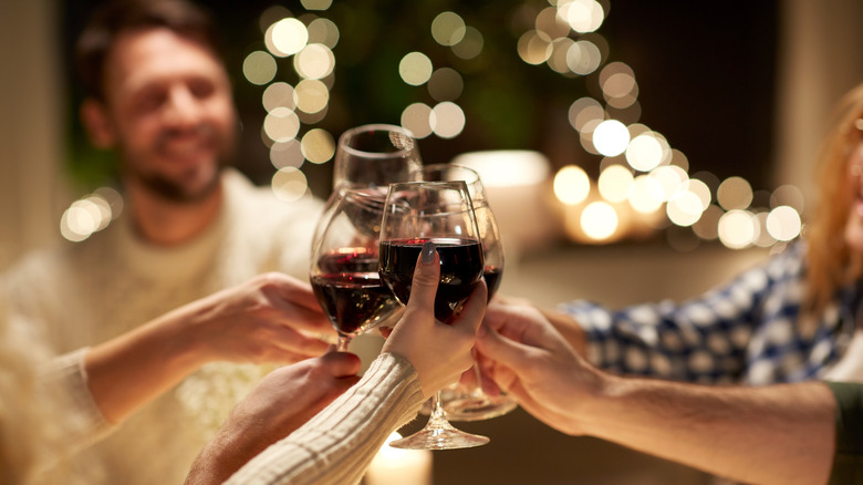 relaxing dinner party cheers with wine glasses