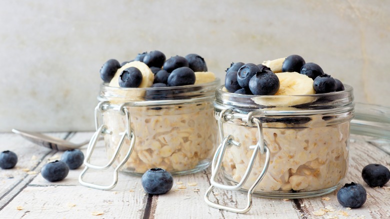 two jars of oatmeal with fruit