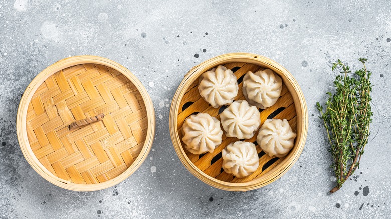 Baozi dumplings in bamboo steamer