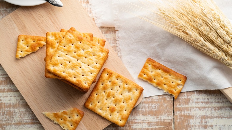 Saltines on cutting board