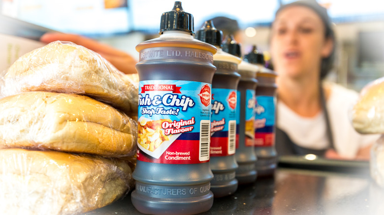 Bottles of non-brewed vinegar condiment at fish and chip shop