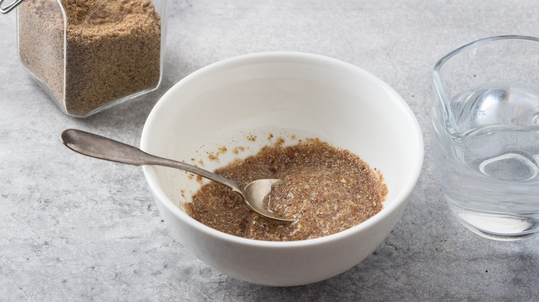 Flax meal and water in white bowl