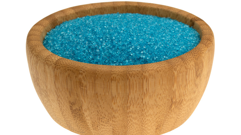 Wooden bowl of blue sanding sugar