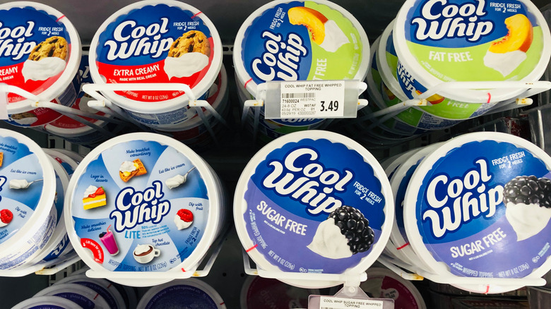 containers of cool whip in grocery fridge