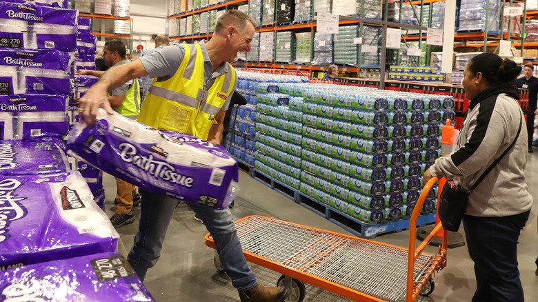 Costco staff helping customer