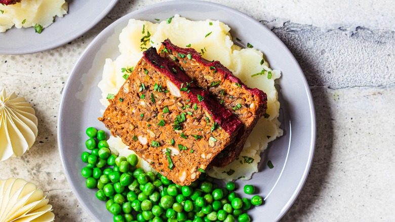 Vegan meatloaf served on mashed potatoes