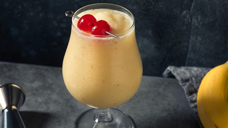 Frozen banana cocktail with cherries 