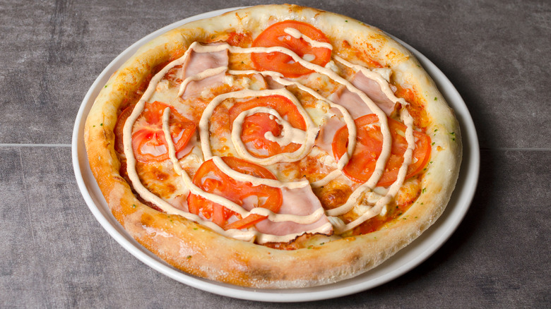 Pizza on a plate with ranch swirl