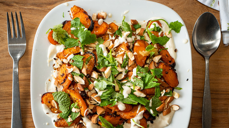 roasted carrots on a plate with almonds 