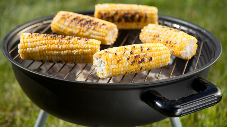 corn roasting on grill