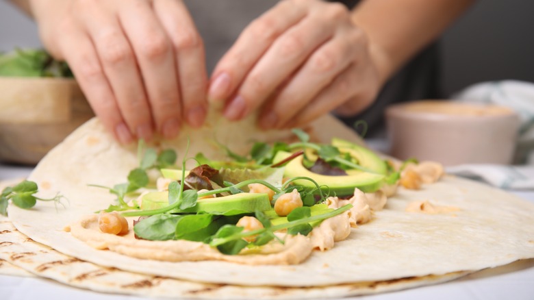 tortilla with hummus and salad