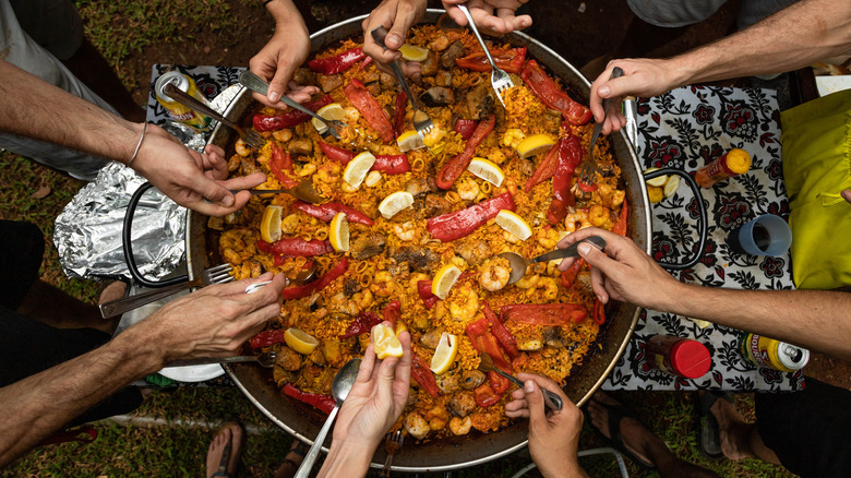 People sharing Spanish Paella