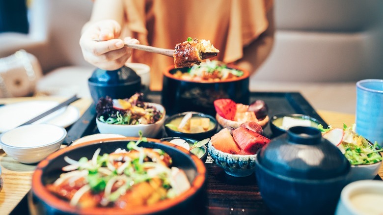 Person eating Japanese food