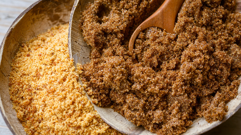 dark and light brown sugars in pie pans with spoon