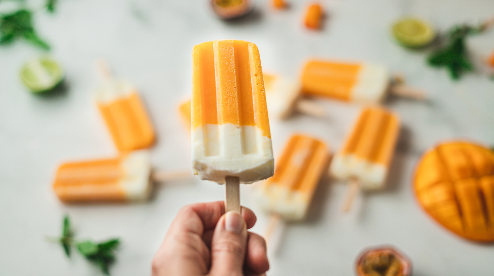 https://www.thedailymeal.com/img/gallery/for-creamy-popsicles-all-you-need-is-frozen-fruit-and-condensed-milk/l-intro-1694464999.jpg