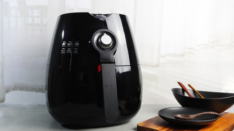 Black air fryer and bowls