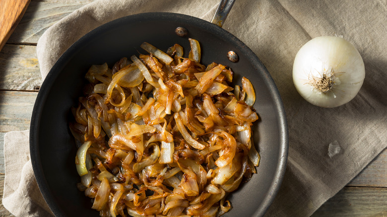 caramelized onions in pan and whole onions