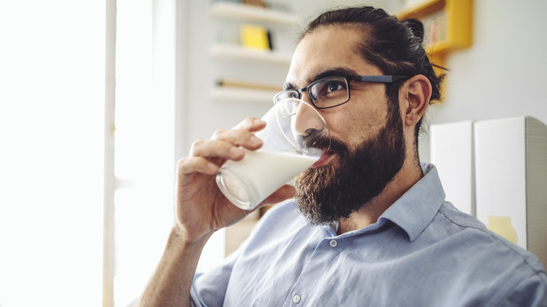 Man drinking glass of milk