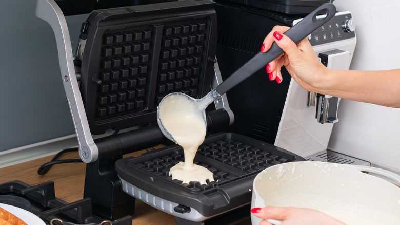 Pouring batter in a waffle maker