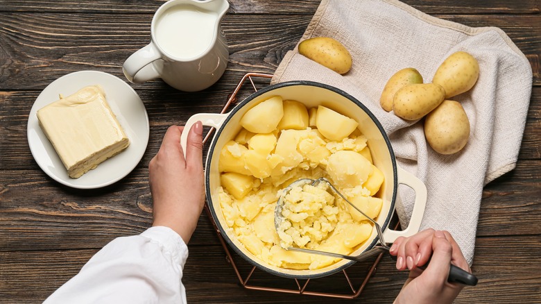 mashing potatoes by hand