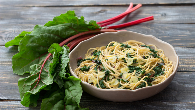 bowl of pasta with sauteed garlic and Swiss chard