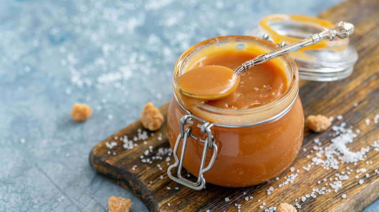 caramel sauce in jar with salt on the side