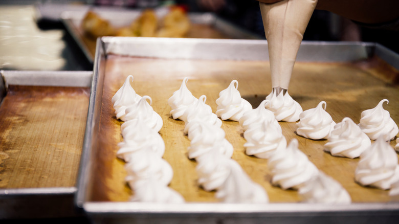 Piping meringue onto tray