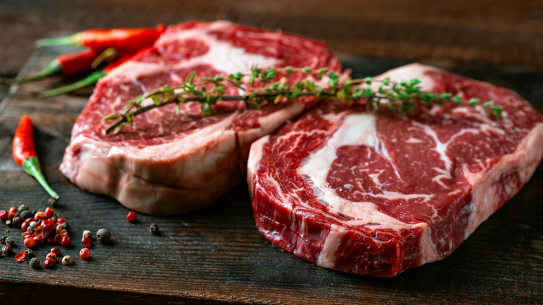 Raw steaks with marbling