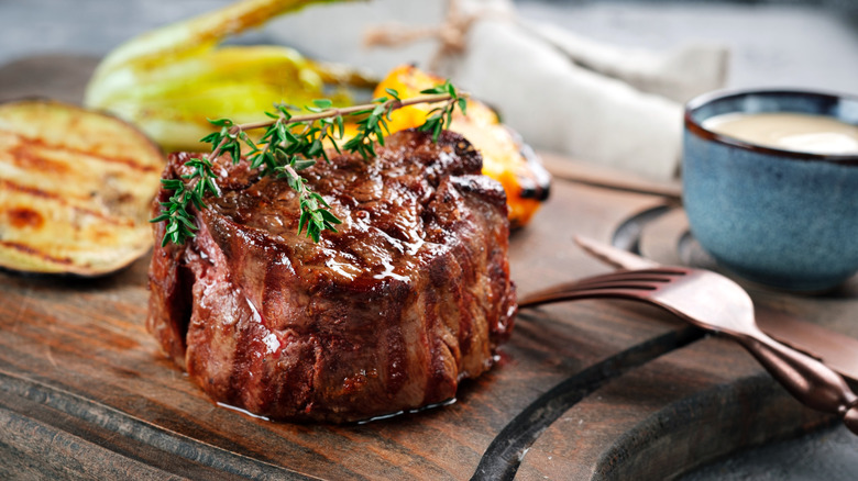 Tenderloin on a board with veggies