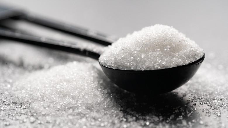 Up-close photo of a tablespoon of sugar