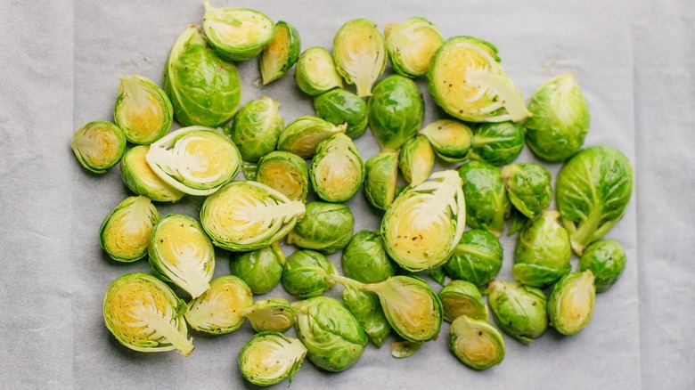 Halved Brussels sprouts on white