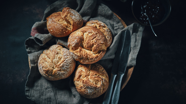 Crusty loaves of bread in linen