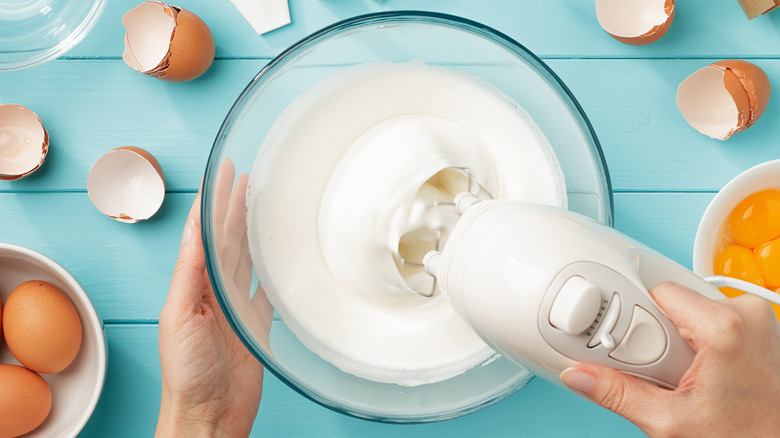 Whipping egg whites into meringue with hand mixer