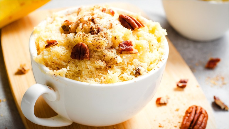 Banana mug cake with chopped pecans 