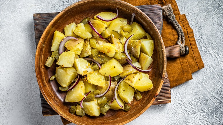 Potato salad in wooden bowl