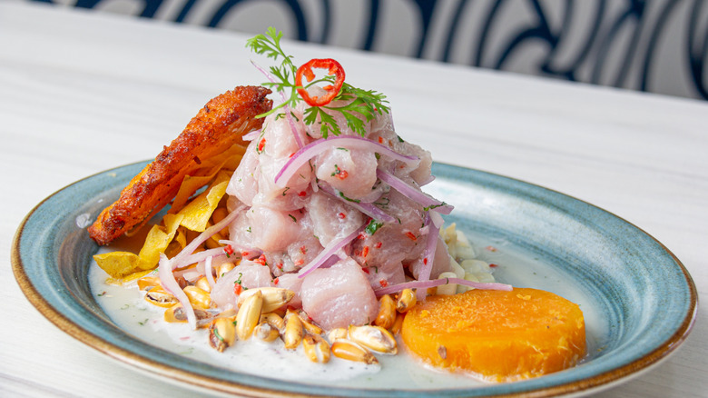 Ceviche piled on blue plate