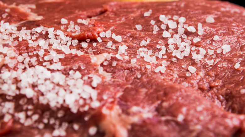 close-up of salt on raw meat