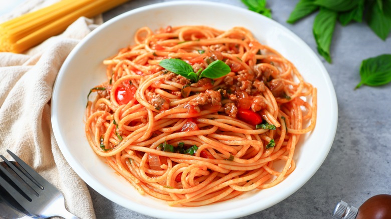 A little kid eating spaghetti