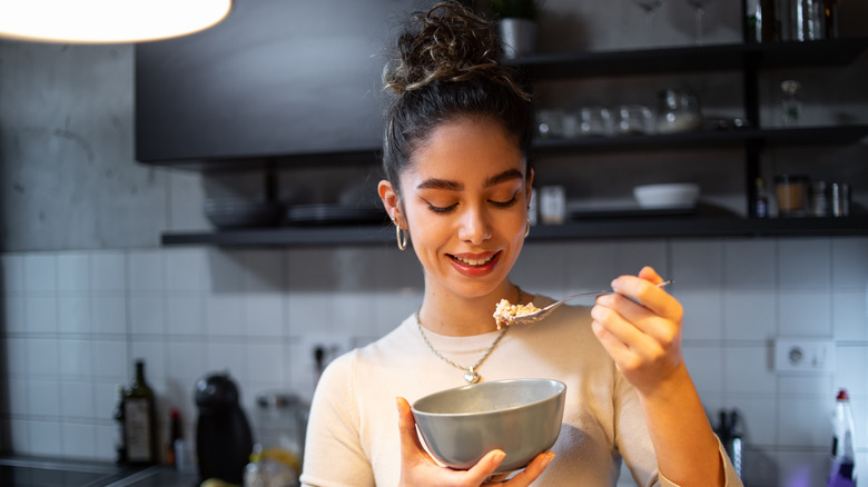 A woman eating oatmeal