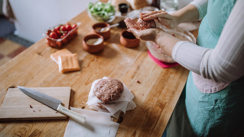 shaping burger meat into patties